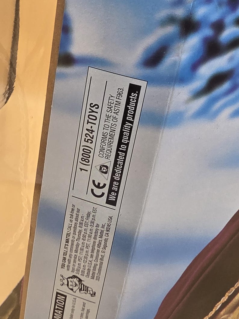 May include: A product packaging section featuring the text 1 (800) 524-TOYS, CONFORMS TO THE SAFETY REQUIREMENTS OF ASTM F963, and We are dedicated to quality products. The box includes a CE mark, a small icon of a child, and contact information.