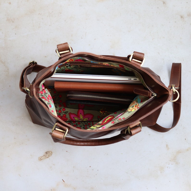 large brown distressed leather tote with floral fabric lining