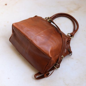 tan leather tote bag with two handles
