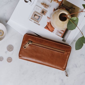 large tan leather ziparound wallet with front pocket