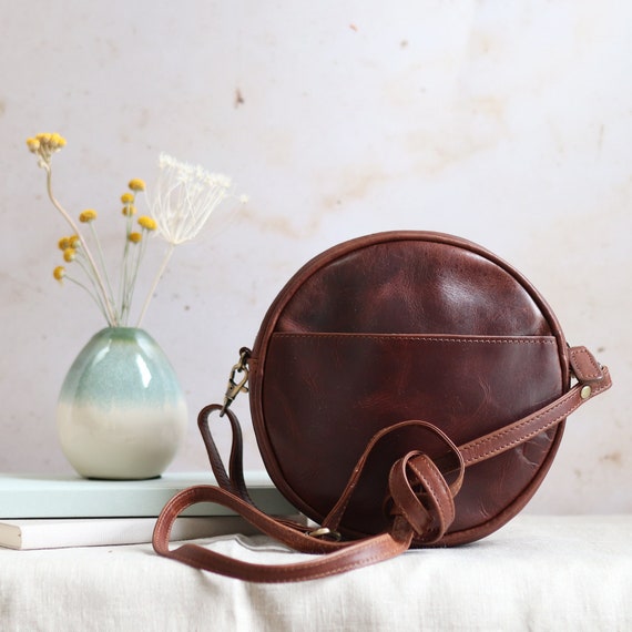 round brown leather bag