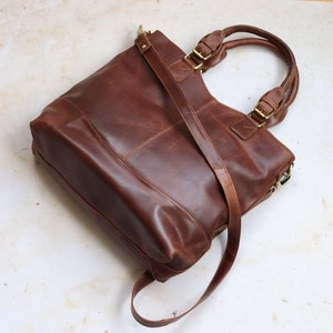 large brown leather tote bag with long strap