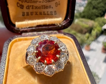 Bague marguerite ancienne en or 14 carats, grenat spessartite et diamants taille ancienne