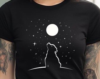 May include: Black t-shirt with a white silhouette of a wolf howling at the moon. The moon is full and white, and there are white stars in the night sky.