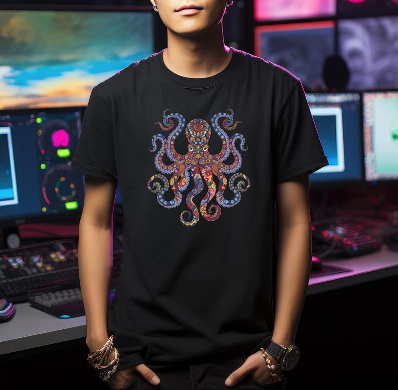 May include: Black t-shirt featuring a colorful octopus design. The octopus has intricate patterns in shades of red, blue, orange, and yellow. The design is centered on the shirt, creating a bold and eye-catching graphic.