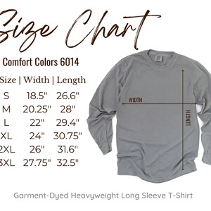 May include: Size chart for a long-sleeved t-shirt in Comfort Colors 6014. The chart shows the width and length measurements in inches for sizes S, M, L, XL, 2XL, and 3XL. The text "Garment-Dyed Heavyweight Long Sleeve T-Shirt" is at the bottom of the chart.