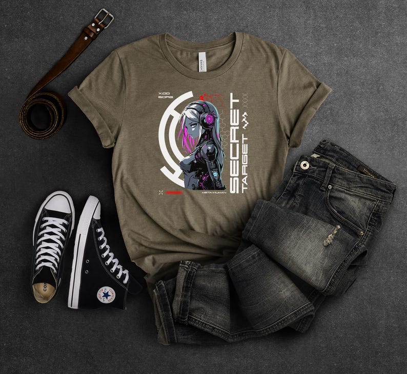 May include: A brown t-shirt with a graphic of a woman with pink hair and a futuristic design. The text "SECRET TARGET" is printed on the shirt.