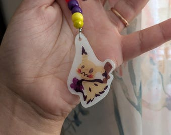 Mimikyu Charm - Llavero de plástico con accesorio