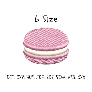 May include: An embroidery design of a pink macaron with a white cream filling. The text 6 Size is centered above the macaron. Below the macaron, the text reads DST, EXP, HUS, JEF, PES, SEW, VP3, XXX, indicating various digital file formats.