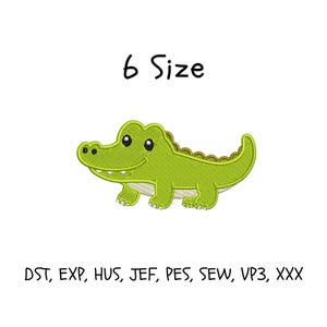 May include: A green embroidered alligator design with the text "6 Size" above it. Below the alligator are the file types: DST, EXP, HUS, JEF, PES, SEW, VP3, XXX. The alligator has a smiling face and is on a white background.