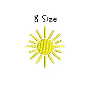May include: A yellow sun with 12 rays, embroidered on a white background. The text "8 Size" is above the sun.