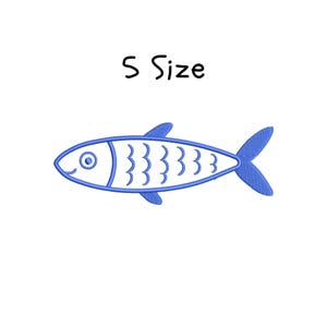 May include: A blue embroidered fish design with the text "S Size" in black. The fish has a simple outline with details including an eye, fins, and wavy lines along its body. The design is on a white background.