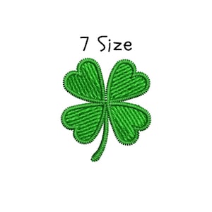 May include: A green embroidered four-leaf clover with the text "7 Size" in black. The clover is a symbol of good luck and is often associated with St. Patrick's Day. The design is on a white background.