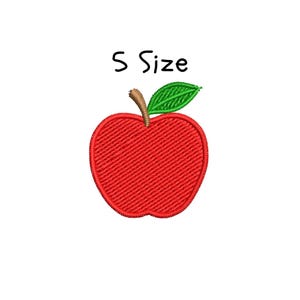 May include: A red embroidered apple with a green leaf and a brown stem. The text "S Size" is above the apple. The apple is a simple, stylized design.