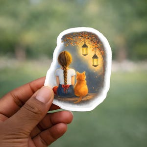 Girl and Cat sticker with a warm lantern glow: a tiny night scene that turns laptops, newspapers, and water bottles into a cozy story.