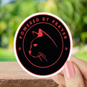 black Cat Sticker , Powered by Prayer Cat Sticker – Faith-Inspired Vinyl Decal for Cat Lovers , Cat Lover Gift
