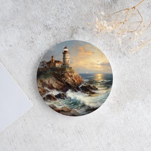May include: A painting depicting a lighthouse perched on a rugged cliff overlooking a turbulent sea. The sun is setting in the distance, casting a golden hue over the water. The lighthouse is white with a red roof and a black lantern. A small boat can be seen sailing in the distance.