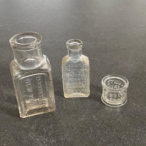 Vintage Apothecary Bottles Clear Glass Embossed Antique Collectible Miniature Tarrant New York, Honey Almond Cream, Dr Lunt&#39;s Eye Salve