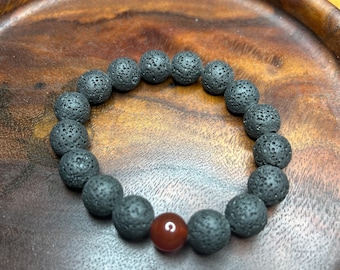 Volcano -  natural lava beads and red agate bead stretch bracelet.