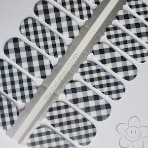 May include: Black and white gingham nail wraps with the text "The Delighted Daisy" on the packaging.