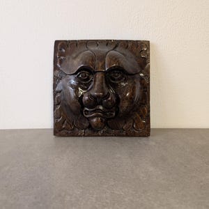 lion head carved from wood