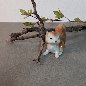 Small hand-painted porcelain squirrel