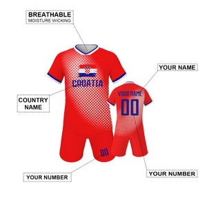 May include: Red Croatia soccer uniform with white and blue accents. The jersey features the Croatian flag and the word "CROATIA". The shorts and jersey have the number "00". The text "BREATHABLE MOISTURE WICKING" is also visible.