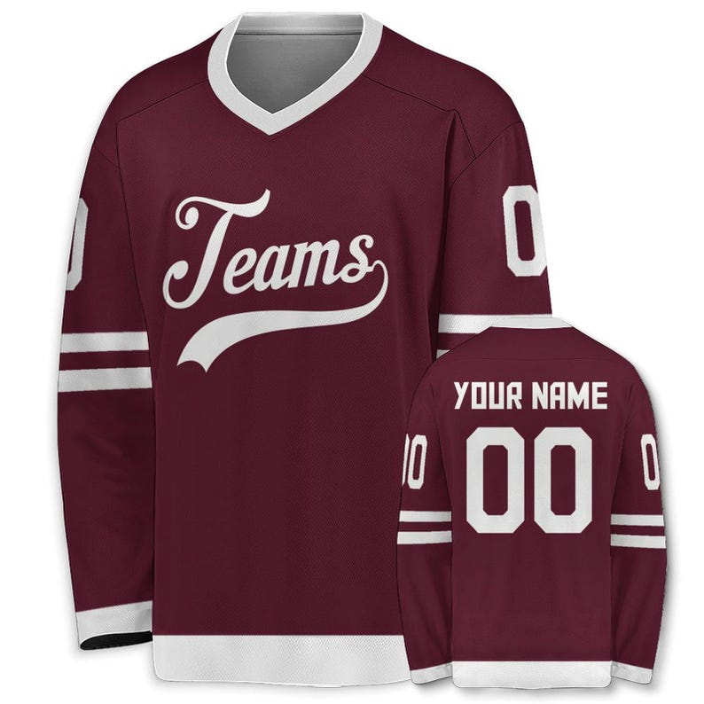 May include: Maroon hockey jersey with white accents. The jersey features the word "Teams" in a script font on the front. The back of the jersey has the text "YOUR NAME" above the number "00". White stripes adorn the sleeves.