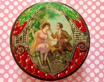 Vintage Cherry Toffee Candy Tin Container Round Tin with Man Feeding Cherries to Woman on Ladder