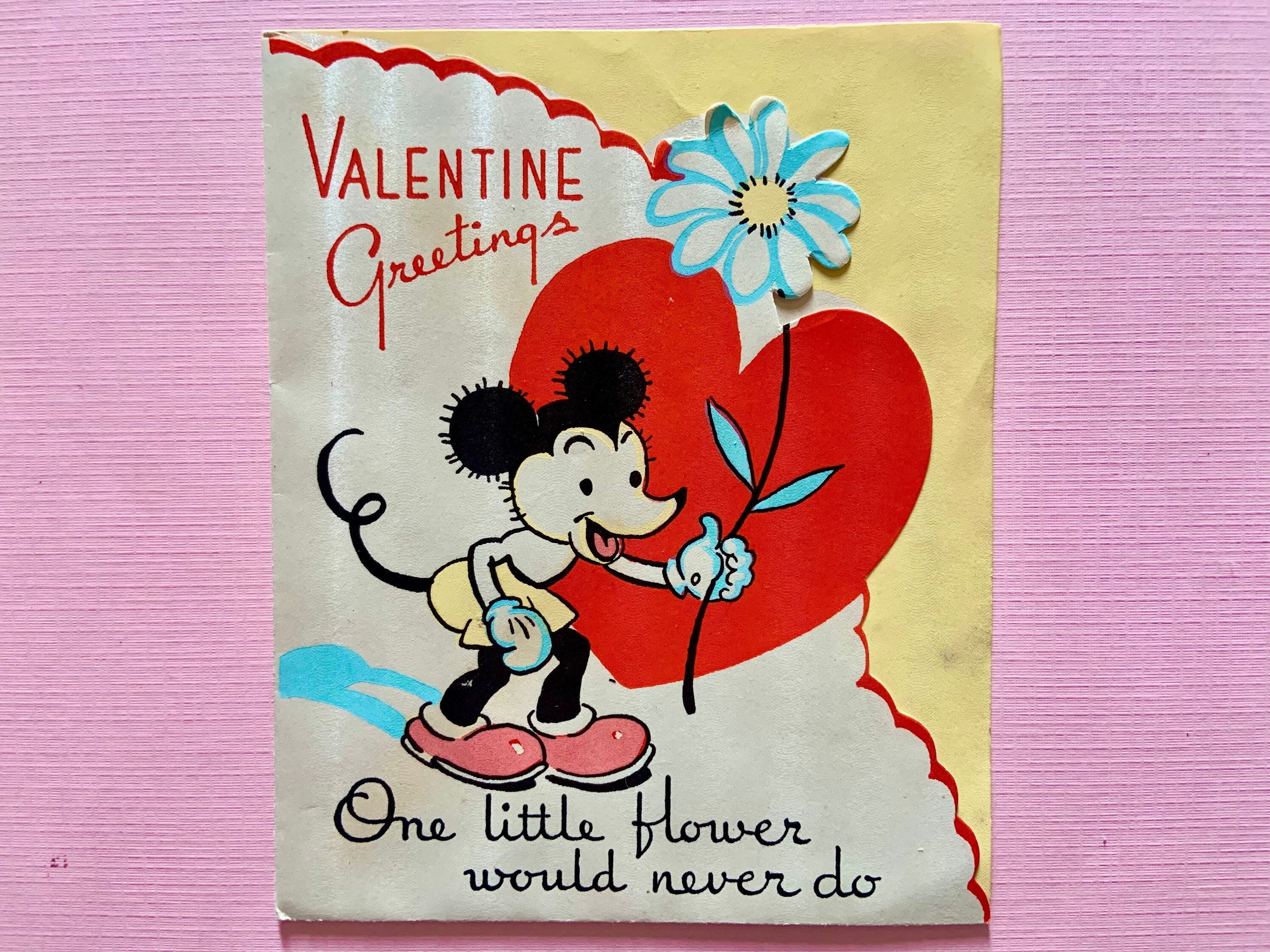 Mickey Mouse Holding Flowers