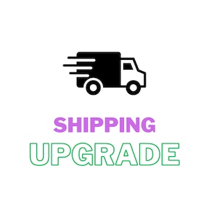 May include: A black and white graphic of a delivery truck with speed lines, above the words "SHIPPING UPGRADE" in purple and green. The image is on a white background, suggesting an e-commerce or delivery service.