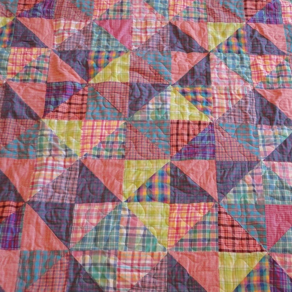 Brightly colored homespun twin size quilt