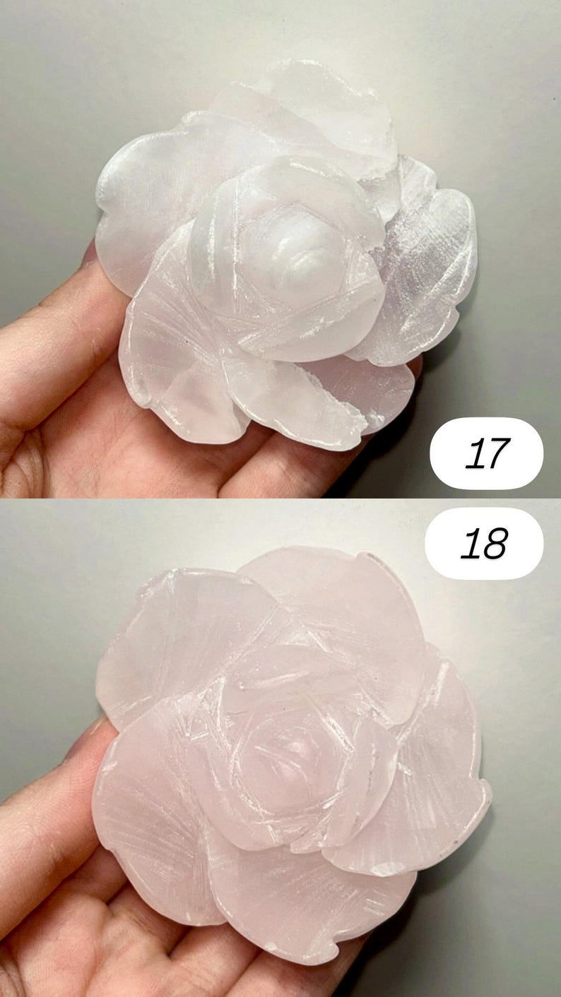May include: Two carved stone rose sculptures. The top rose is white, and the bottom rose is pink. The petals are detailed with carved lines. The numbers "17" and "18" are printed on the image.