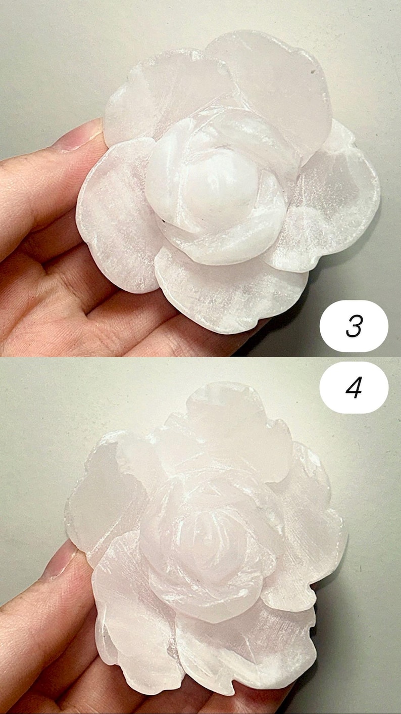 May include: Two views of a carved, light pink rose. The stone flower has detailed petals and a textured surface. The rose is held in a hand, with the numbers 3 and 4 visible in the background.