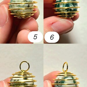 May include: Close-up of four gemstone pendants. Each pendant features a spherical, speckled stone encased in a gold-colored wire cage. The wire forms a spiral around the stone, with a loop at the top for hanging. The stones have green and white patterns.