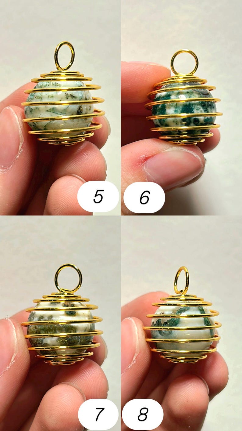 May include: Close-up of four gemstone pendants. Each pendant features a spherical, speckled stone encased in a gold-colored wire cage. The wire forms a spiral around the stone, with a loop at the top for hanging. The stones have green and white patterns.