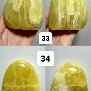 May include: Four views of freeform, polished yellow-green stones. The stones have a smooth, rounded shape with visible internal patterns and variations in color. The text "(Two sides - 1 Freeform)", "33", and "34" are visible.