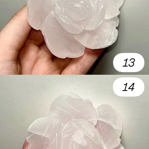 May include: A carved rose made of pale pink stone. The flower is in full bloom, with detailed petals. The image is split into two sections, each showing a different angle of the rose. Numbers 13 and 14 are in the background.
