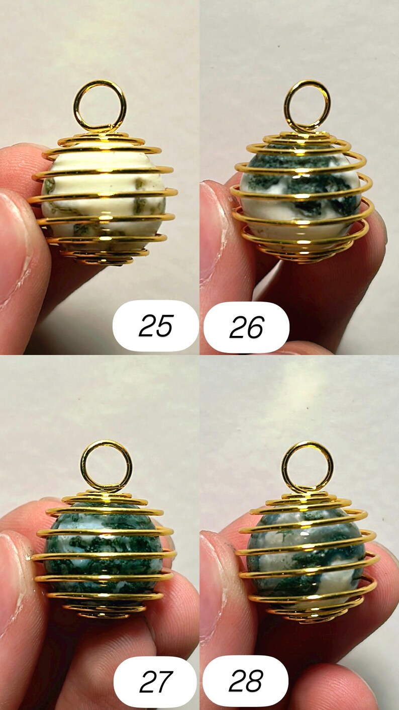 May include: Four gemstone pendants with gold-colored wire cage designs. The gemstones are white with green inclusions and green with white inclusions. Each pendant has a small loop at the top. Numbers 25, 26, 27, and 28 are visible.