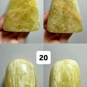 May include: Four polished, freeform yellow-green gemstones. Two are numbered 19, and two are numbered 20. The stones have a smooth, rounded shape with visible internal patterns and variations in color. The text at the top reads "(Two sides - 1 Freeform)".