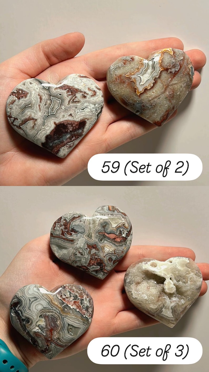 May include: Heart-shaped stones with unique patterns in shades of gray, brown, and white. The image includes two sets of heart-shaped stones, one set of two and another set of three. The text "59 (Set of 2)" and "60 (Set of 3)" is visible.