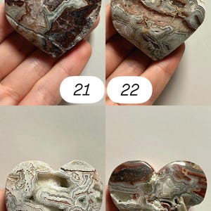 May include: Four heart-shaped stones with unique patterns and colors. The stones are shades of brown, white, and gray, with intricate veining. Each stone is numbered: 21, 22, 23, and 24. These decorative stones are ideal for collectors.