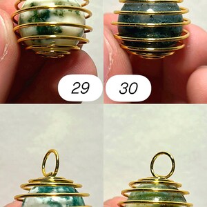 May include: Four gemstone pendants with gold-colored wire wrapping. Each pendant has a different colored stone: white with green, dark green, white with blue-green, and yellow-green. Numbers 29, 30, 31, and 32 are printed on the image.