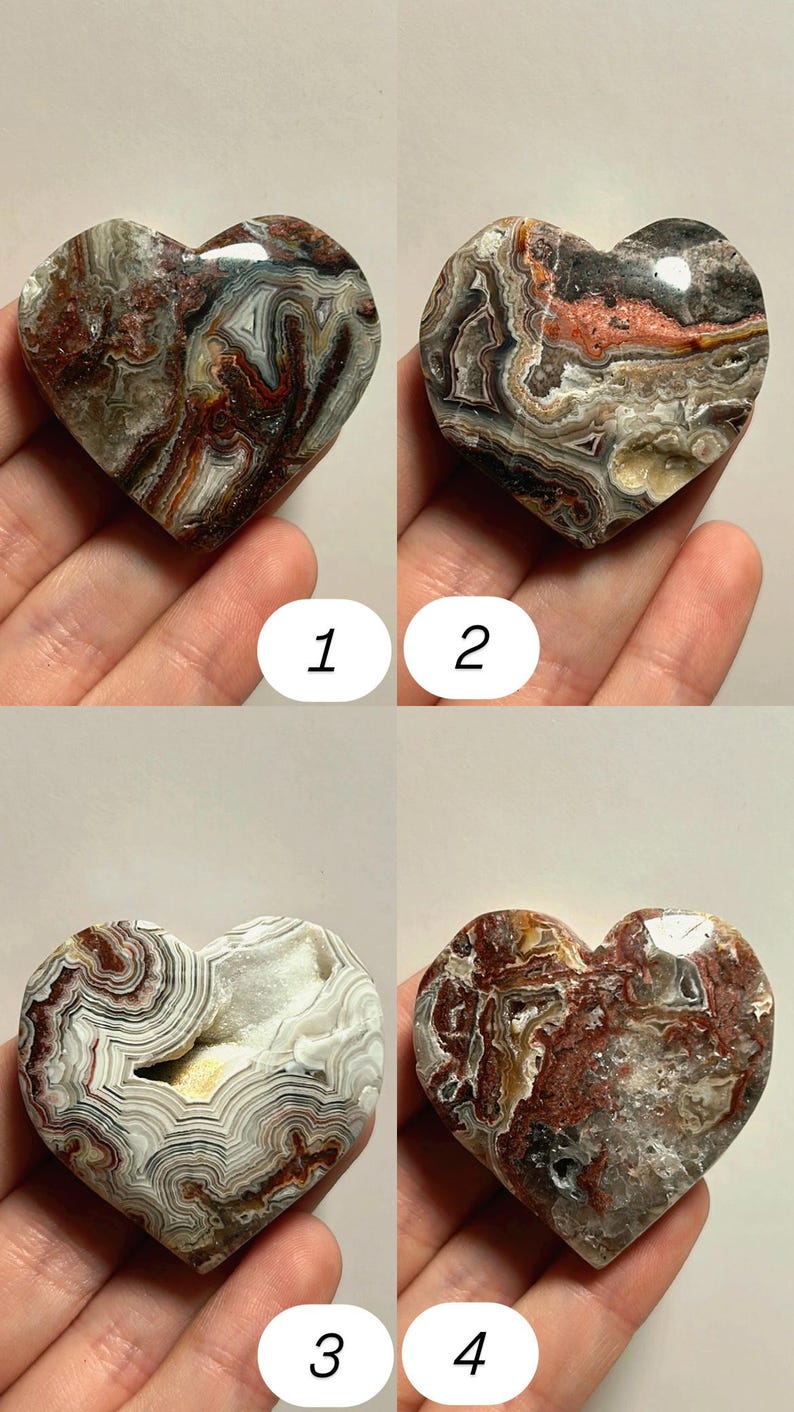 May include: Four heart-shaped stones with unique patterns and colors. The stones are numbered 1 through 4. The stones have a variety of colors including brown, red, white, and gray. The stones are held in a person's hand.