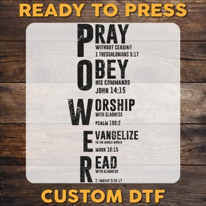 May include: A rectangular DTF transfer with the word "POWER" in large, bold, black letters. Each letter represents a word: Pray, Obey, Worship, Evangelize, and Read, with associated Bible verses. The words "READY TO PRESS" and "CUSTOM DTF" are in gold.