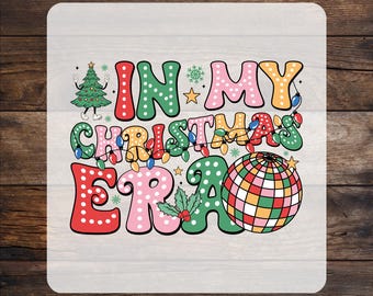 May include: A DTF transfer sheet featuring the text IN MY CHRISTMAS ERA in colorful, polka-dotted bubble letters. The design includes a cartoon Christmas tree, a disco ball, holly leaves, small stars, snowflakes, and a string of colorful holiday lights.