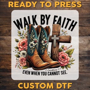 May include: A white background with the text "Walk by Faith" in a brown and blue font. The text is surrounded by a floral design with two brown cowboy boots and a wooden cross with a metal cross on top. The text "2 Corinthians 5:7" is below the boots and cross. The text "Even when you cannot see." is below the scripture reference.