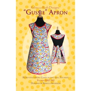 May include: A retro-style apron with a floral pattern of yellow flowers, blue leaves, and red accents. The apron is displayed on a mannequin, with a matching bib and a bow in the back. The text on the image reads "Gussie Apron" and "Rebecca Ruth Designs".
