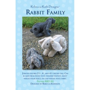 May include: A sewing pattern for a rabbit family. The pattern includes instructions for making three rabbits, each a different size: 2 1/2 inches, 4 inches, and 4 1/2 inches tall. The rabbits can be made from felted wool sweaters, heavy-weight polar fleece, or coat-weight wool fabric. The pattern is called "RRD 112" and is designed by Rebecca Anderson.