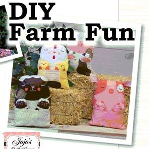 May include: DIY Farm Fun - A set of three plush farm animal pillows. The pillows are made of colorful fabric with embroidered details. The pillows are arranged on a bale of hay. The pillows feature a pig, a cow, and a sheep.
